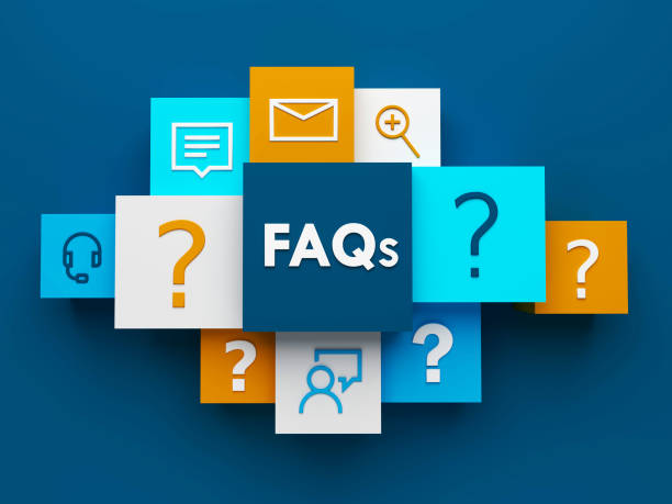 FAQ letters on wooden blocks with a pencil, notepad, and decorative plant
